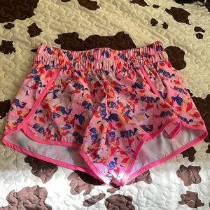 Flowy sport shorts NEVER WORN; small pocket on back of the waist